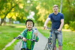 father with shared custody taking son out for a bike ride